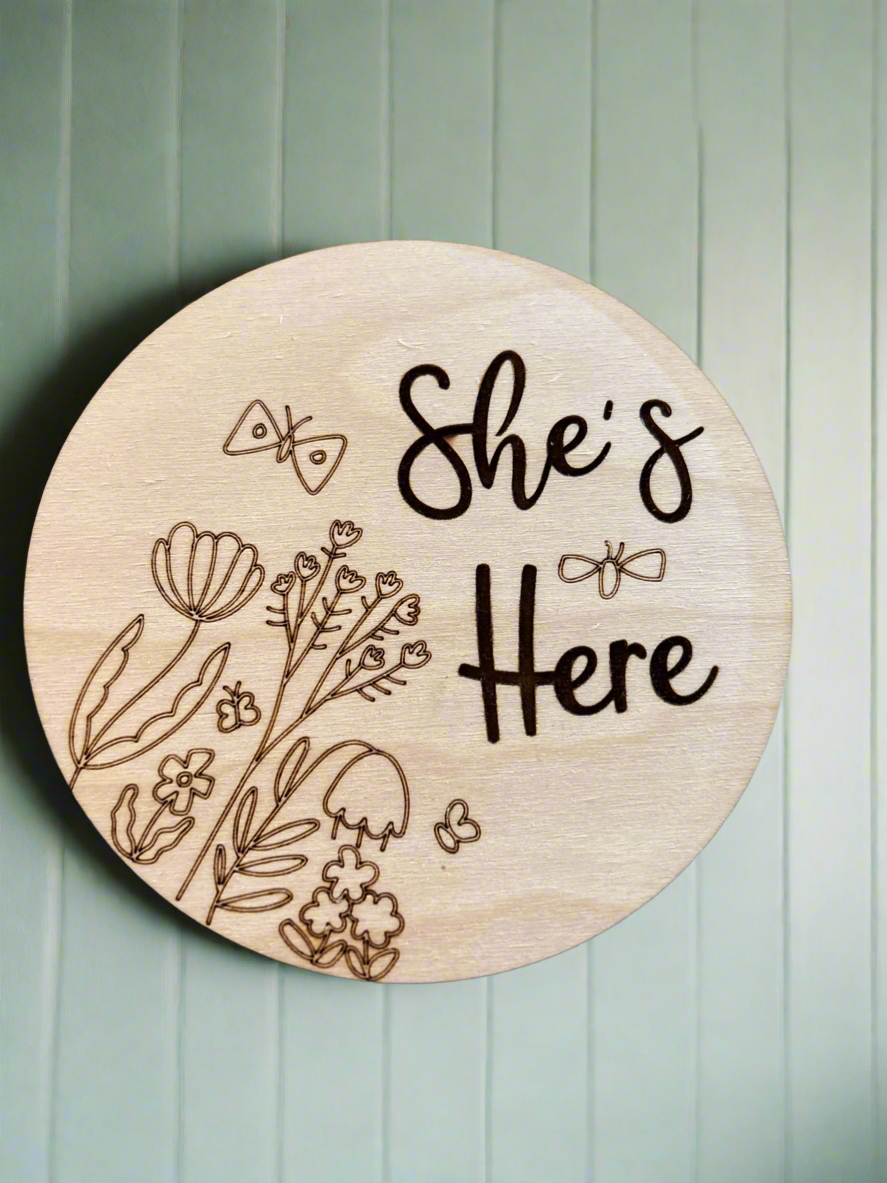 She’s Here Engraved Floral Birth Announcement Round